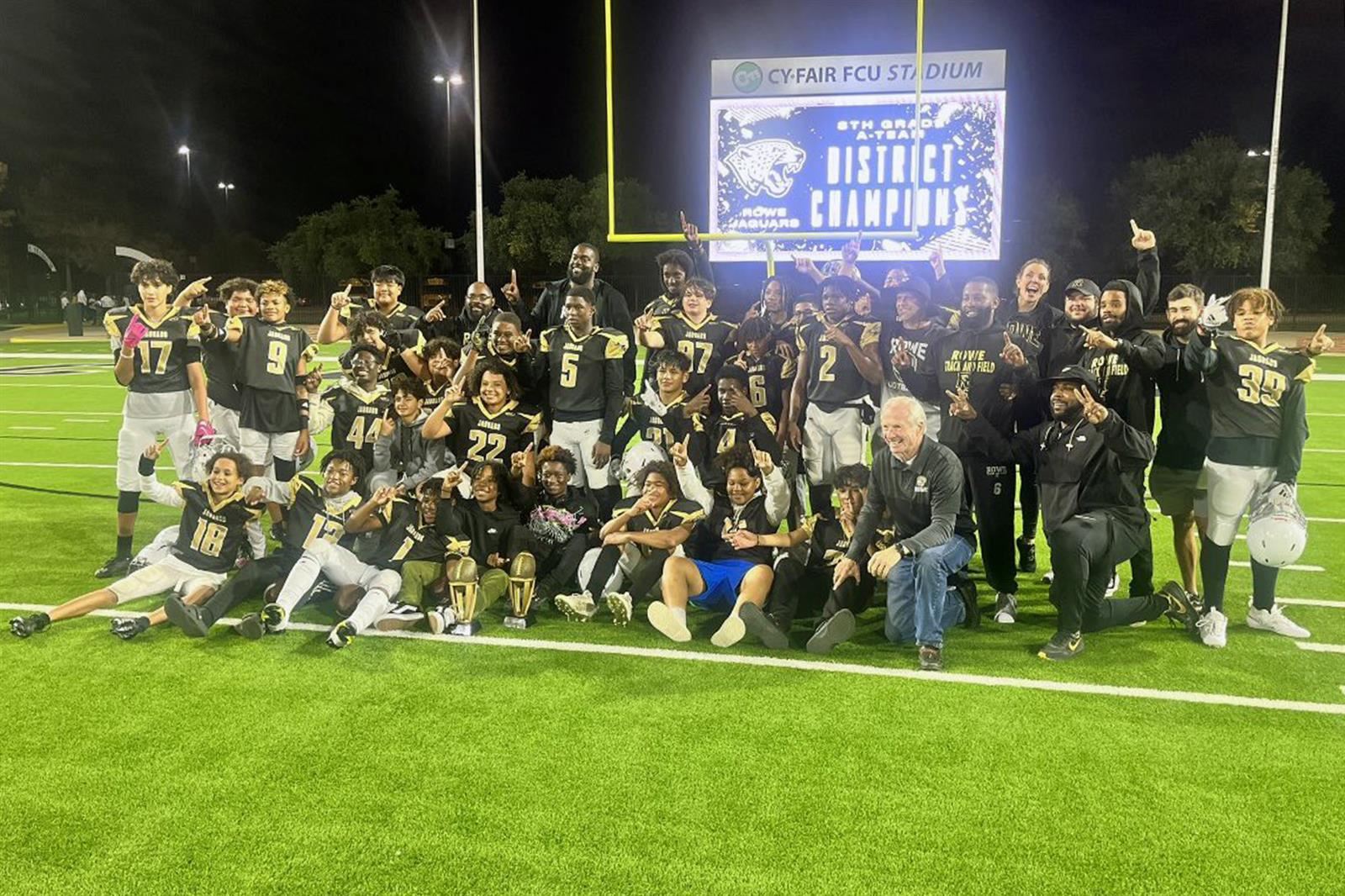 The Rowe 8A football team poses after defeating Truitt to become the first-ever outright district champions.